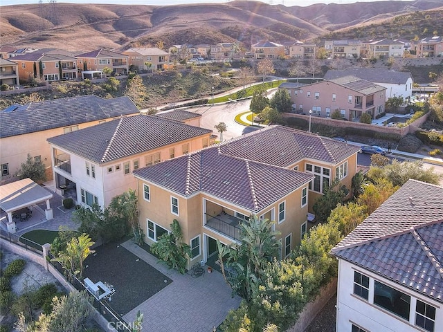 birds eye view of property with a mountain view