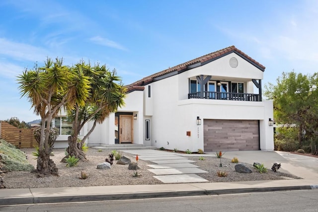 view of front of property with a balcony and a garage