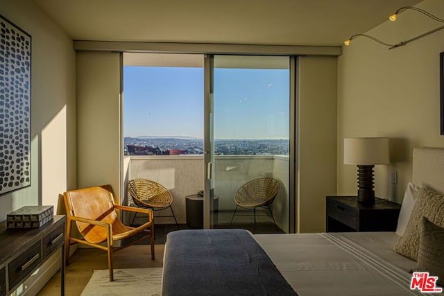 bedroom with light hardwood / wood-style floors