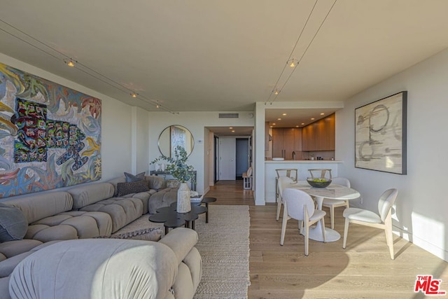 living room with light hardwood / wood-style flooring