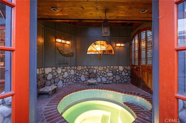 interior space featuring an in ground hot tub