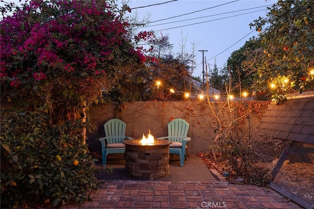 view of patio / terrace featuring a fire pit