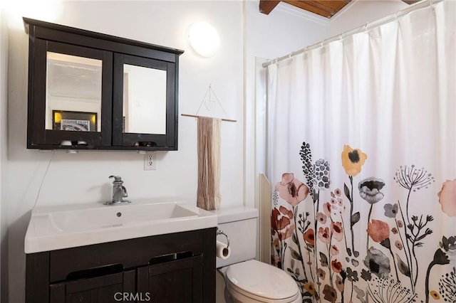 bathroom with vanity, ornamental molding, toilet, and a shower with shower curtain