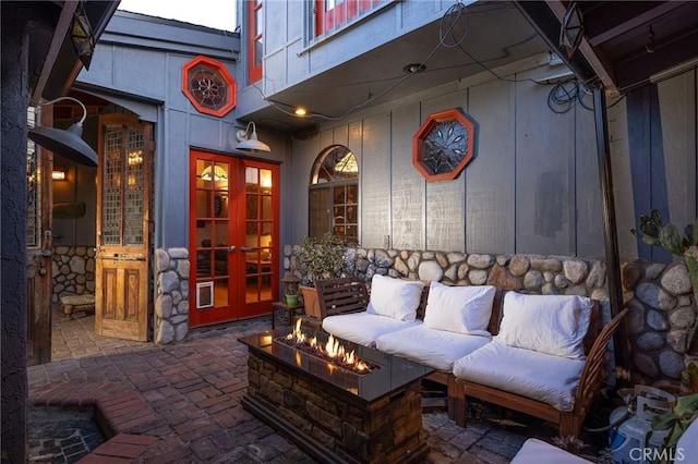 view of patio featuring a fire pit and french doors