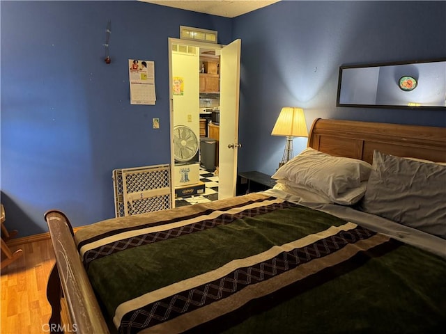 bedroom featuring hardwood / wood-style flooring