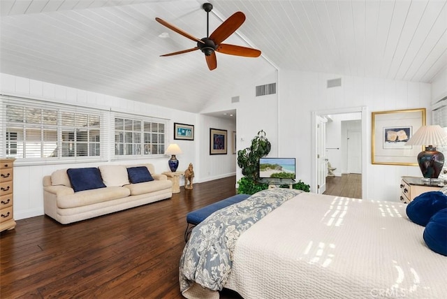 bedroom with ceiling fan, vaulted ceiling, and dark wood-type flooring