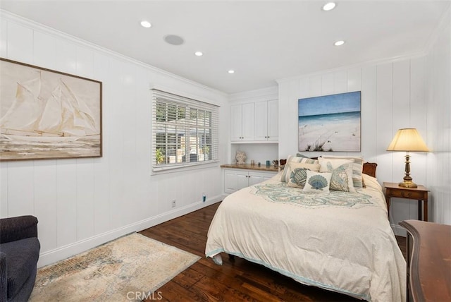 bedroom with dark hardwood / wood-style flooring and ornamental molding