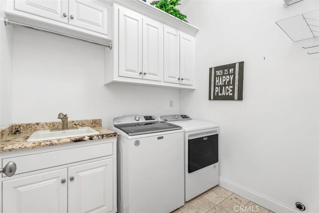 laundry room featuring light tile patterned flooring, sink, separate washer and dryer, and cabinets