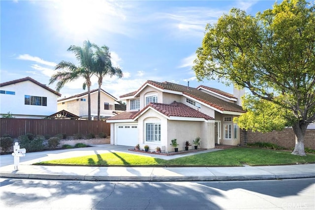 view of front of home with a garage and a front lawn