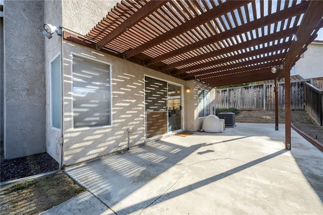 view of patio / terrace with cooling unit and a pergola