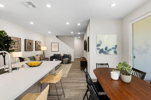 dining space featuring light hardwood / wood-style floors