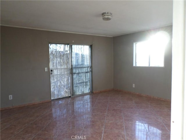 spare room with tile patterned floors