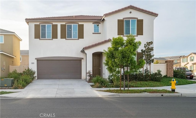 mediterranean / spanish-style home featuring a garage