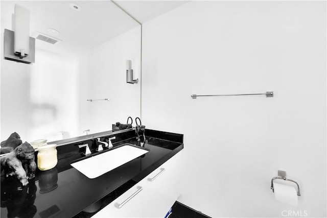 bathroom featuring visible vents and vanity