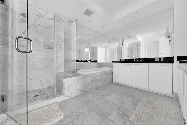 bathroom with marble finish floor, a bath, vanity, visible vents, and a marble finish shower