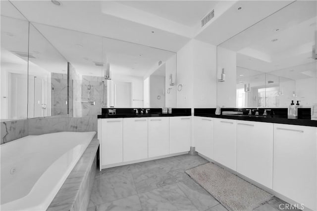 full bath featuring vanity, a marble finish shower, marble finish floor, visible vents, and a tub with jets