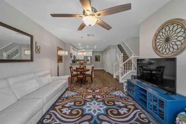 living room with ceiling fan and wood-type flooring