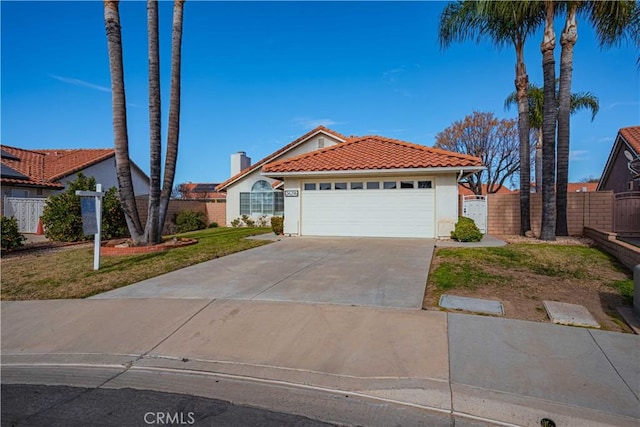 view of front of house featuring a front yard and a garage