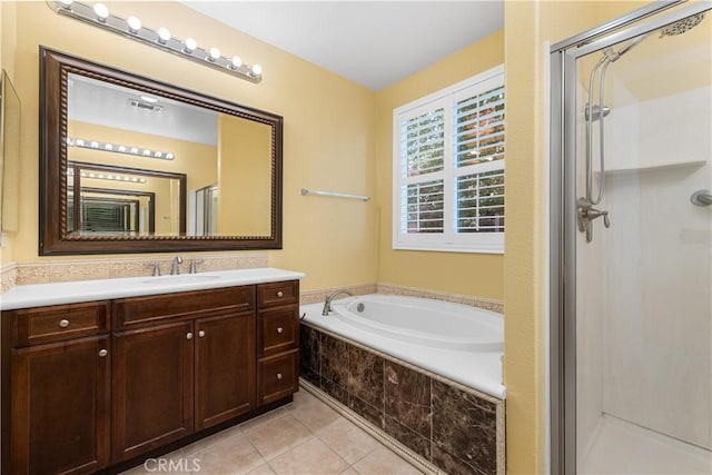 bathroom featuring vanity, tile patterned flooring, and shower with separate bathtub