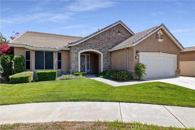 ranch-style house featuring a garage and a front yard