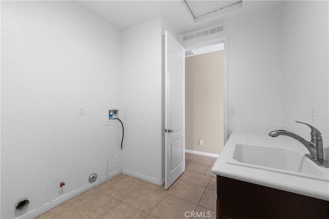 laundry area featuring sink, light tile patterned floors, hookup for a washing machine, and hookup for a gas dryer