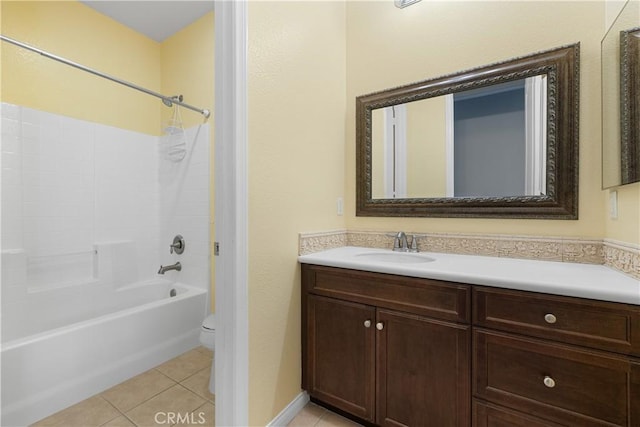 full bathroom with toilet, vanity, tile patterned flooring, and washtub / shower combination