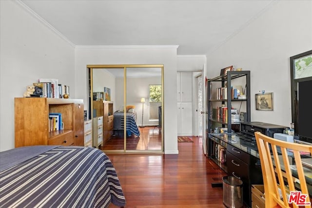 bedroom featuring a closet, dark hardwood / wood-style flooring, and crown molding