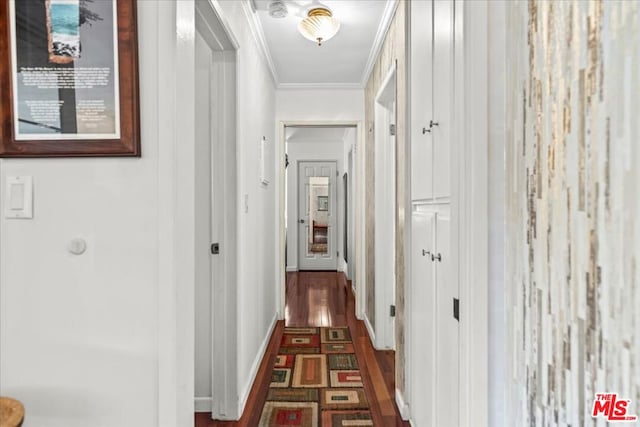 corridor with dark hardwood / wood-style floors and ornamental molding