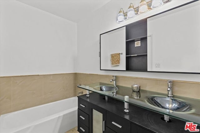 bathroom with a bath and vanity