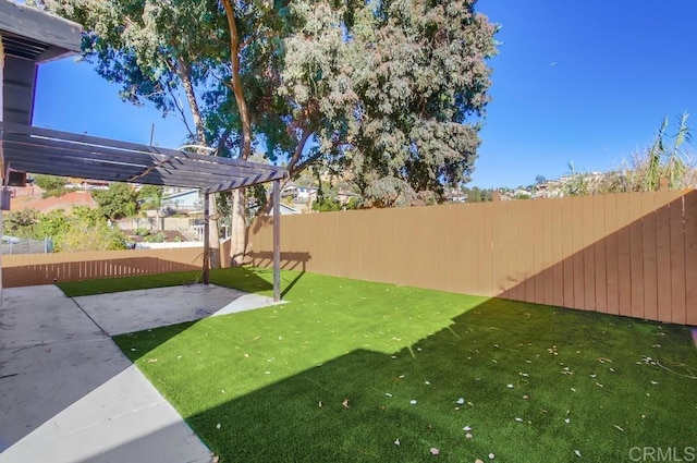 view of yard with a pergola and a patio