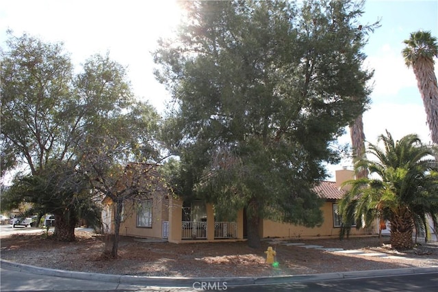 view of property hidden behind natural elements