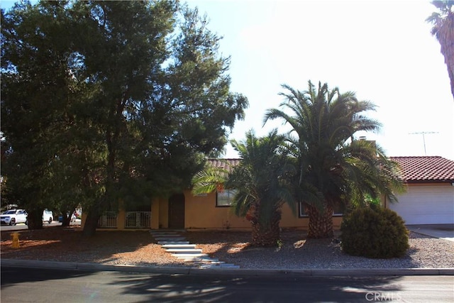 obstructed view of property featuring a garage