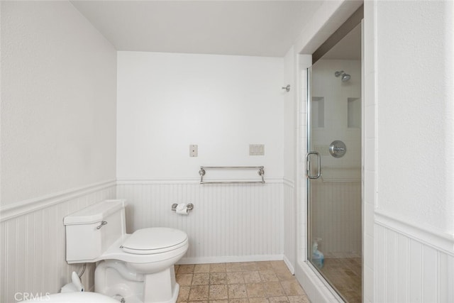 bathroom featuring toilet and walk in shower