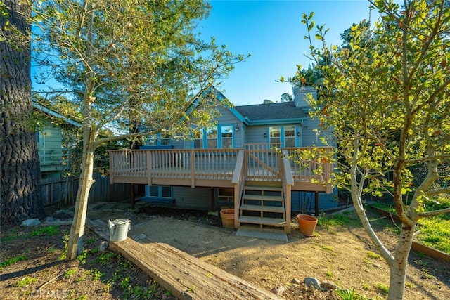 back of house featuring a deck