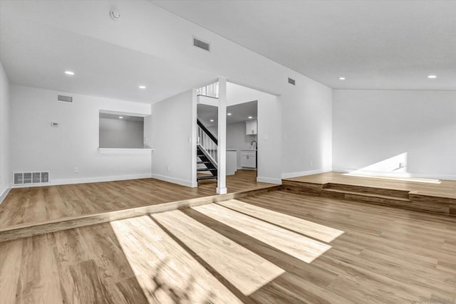 unfurnished living room with light wood-type flooring