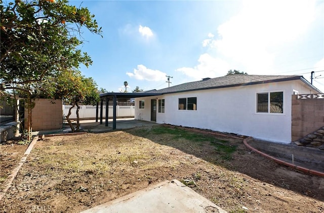 back of property with a patio area