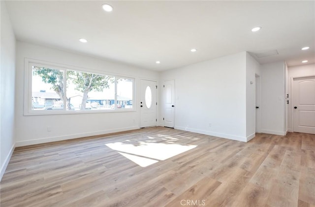 spare room featuring light wood-type flooring