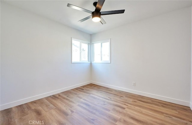 spare room with ceiling fan and light hardwood / wood-style floors