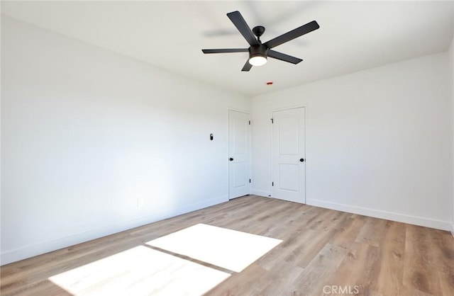 unfurnished room featuring ceiling fan and light hardwood / wood-style floors