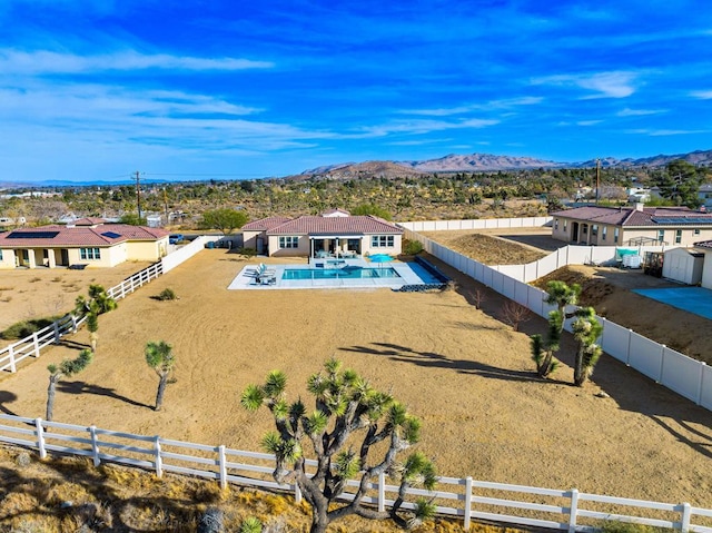 birds eye view of property featuring a mountain view