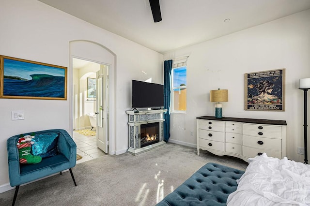 living room featuring light carpet and ceiling fan