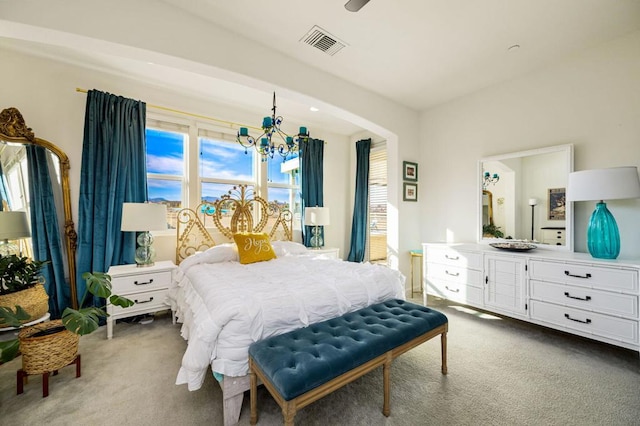 bedroom featuring carpet floors and an inviting chandelier