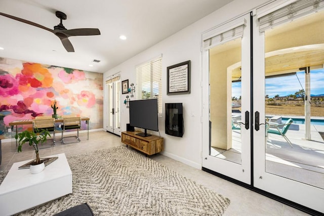 living room with ceiling fan and french doors