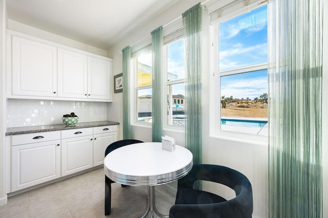 dining room with light tile patterned flooring