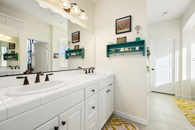 bathroom featuring tile patterned floors and vanity