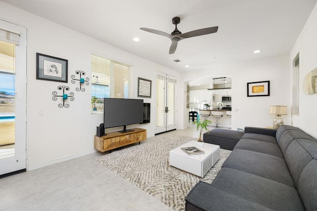 living room featuring ceiling fan