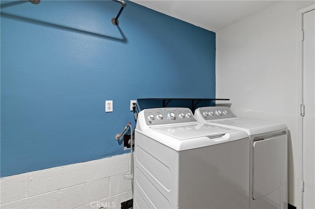 washroom with independent washer and dryer