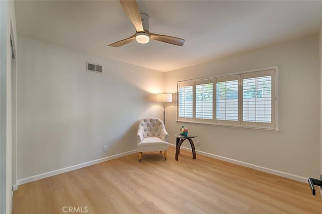 unfurnished room with ceiling fan and light wood-type flooring