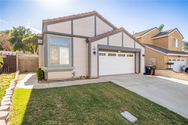 view of front of house with a front lawn and a garage