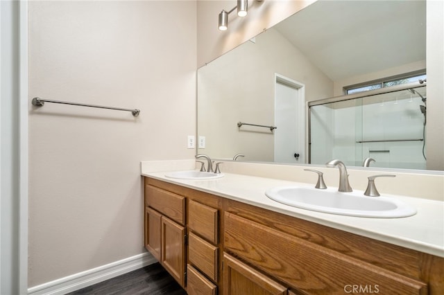 bathroom with vanity, hardwood / wood-style floors, and walk in shower